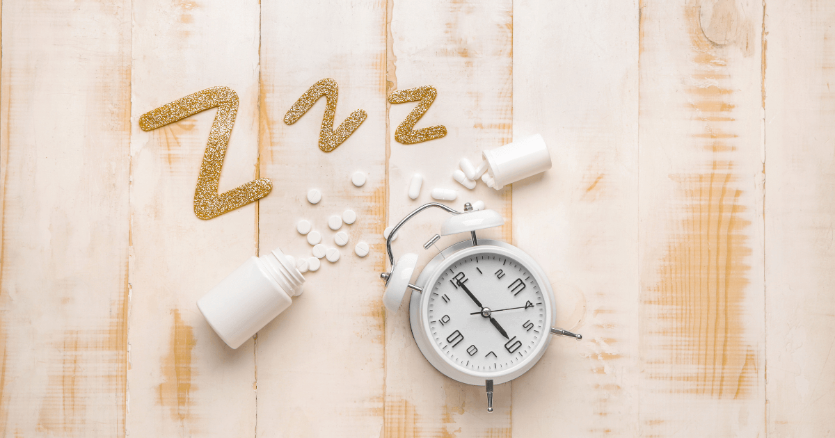 Sleeping pills and clock on a wooden surface related to insomnia struggles | Sip2Sleep®