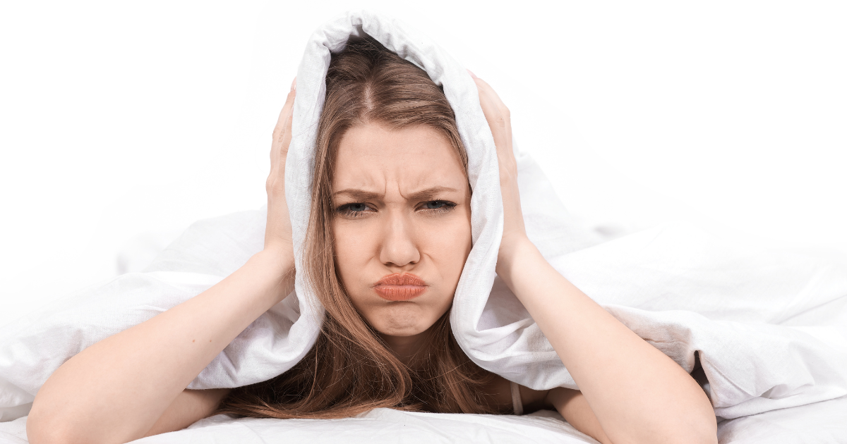 Frustrated woman struggling to fall asleep before trying tart cherry and Venetron® | Sip2Sleep®