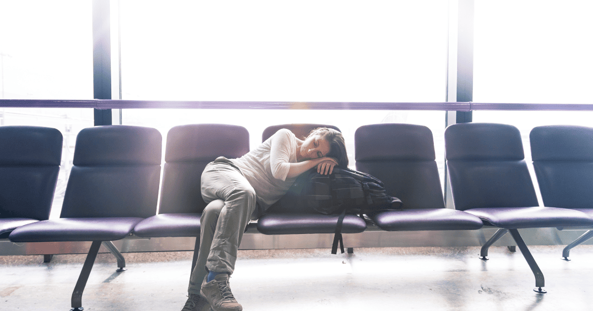 Sleeping woman in an airport lounge due to jet lag