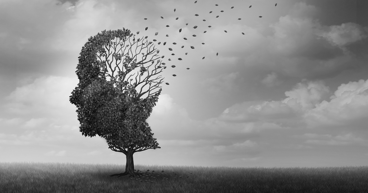 Silhouette of a tree in the shape of a human head losing leaves, symbolizing memory loss and the connection between deep sleep and dementia risk