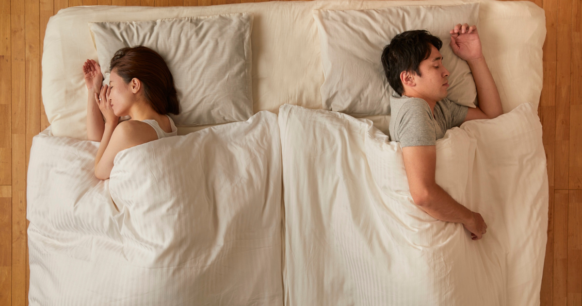 Couple Sleeping Apart in Bed | Sip2Sleep® 