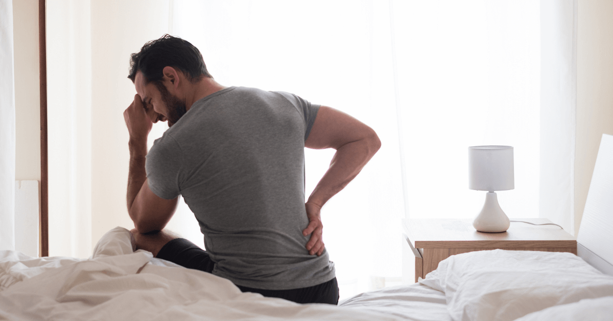 Men waking up in the morning suffer from back pain and headaches.