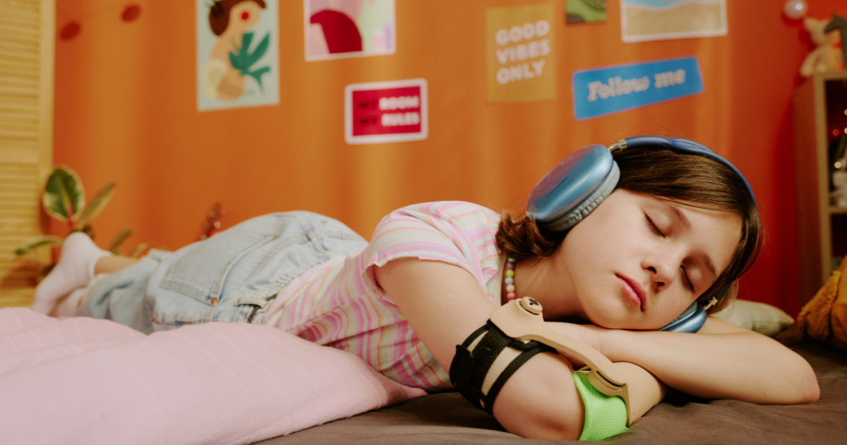 Girl listening to a music while falling asleep