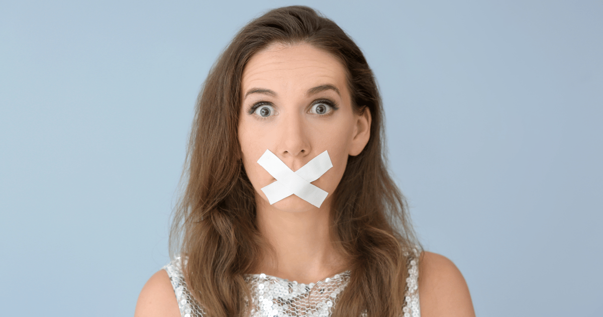 Woman with white tape over her mouth illustrating mouth taping for sleep